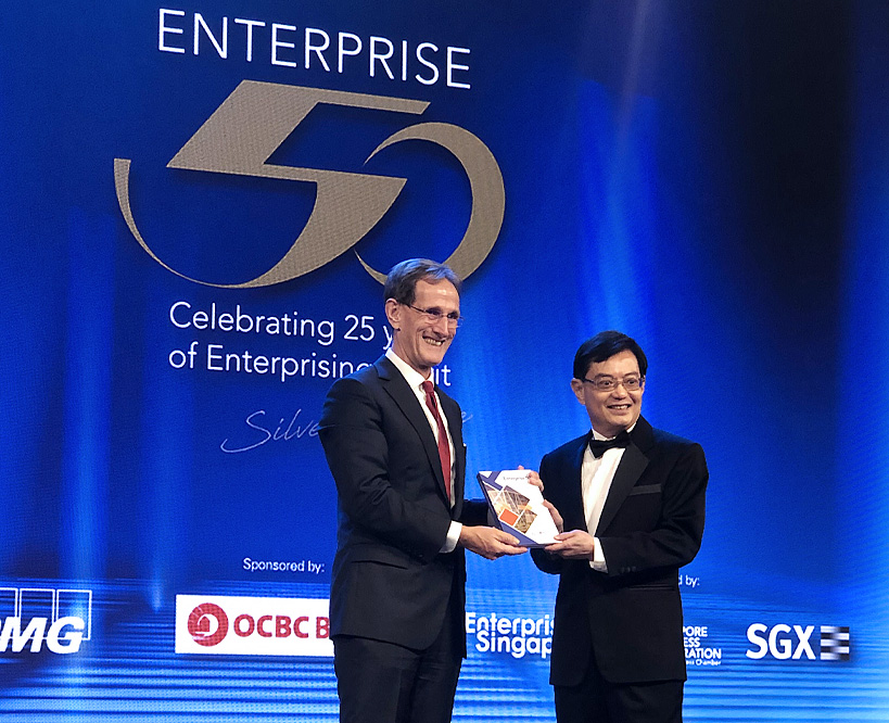 Prof Jochen Wirtz, Vice Dean, Graduate Studies with Deputy Prime Minister and Minister for Finance, Heng Swee Keat receiving a copy of the commemorative coffee-table book, “Enterprise 50 – The best SMEs in Singapore.