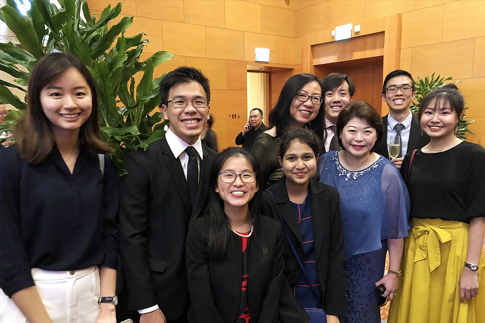 Students celebrating joy and success at the gala dinner with faculty supervisor Prof Ruth Tan (Back row, third from left) and CEO Susan Chong, Greenpac, NUSEMBA Alumna (Class of 2012)- also a donor to the E50 book.