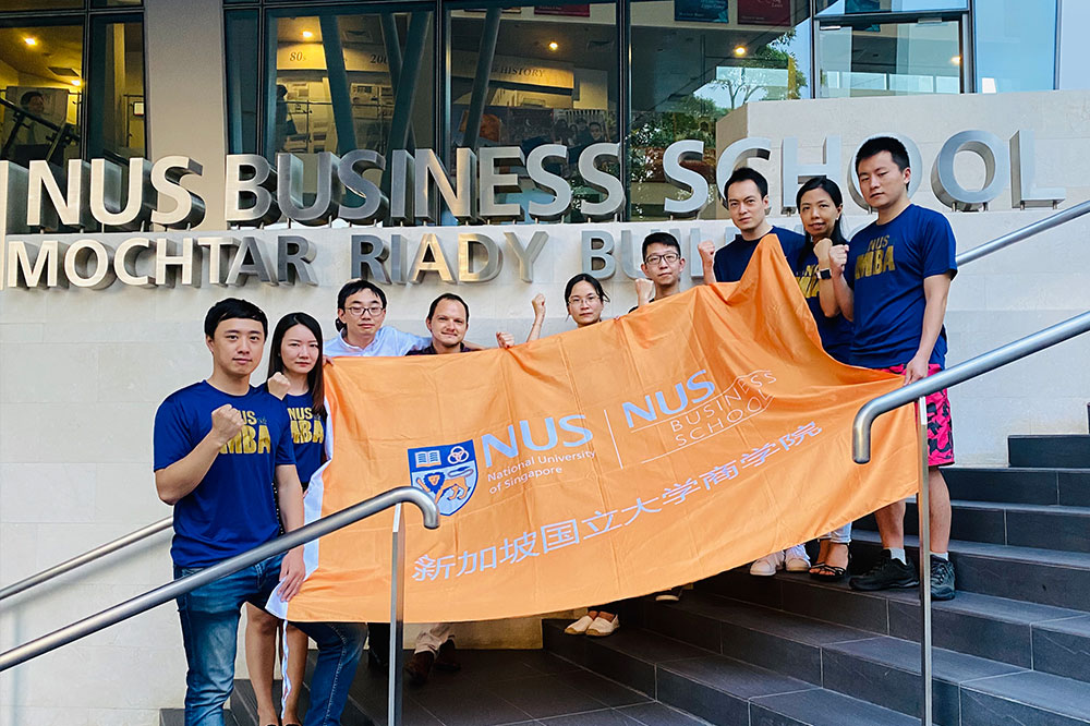 The NUS MBA students are rooting for healthcare professionals in Wuhan. From left: Fan Zhang, Gloria Guo, Andy Chen, Marcel Bandur, Augusta Wang, Kurt Chang, Kevin Xing, Lily Li, and Daniel Zhou
