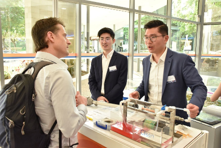 Kelvin (right) with his co-founder Yang Xuan in an exhibition