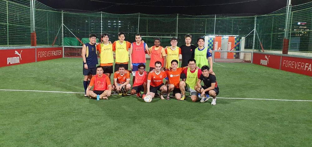 Ajith (front row, centre) with the Shopee football team