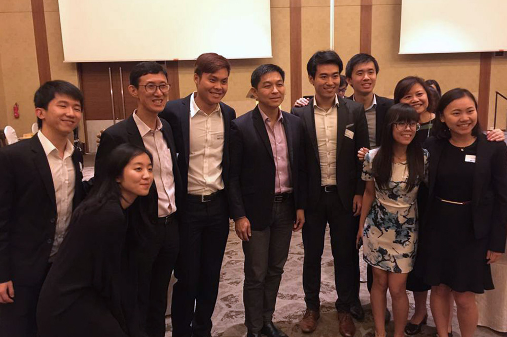 Final year Lu Chang (fifth from right) together with Mr Tan Chuan Jin (fifth from left)