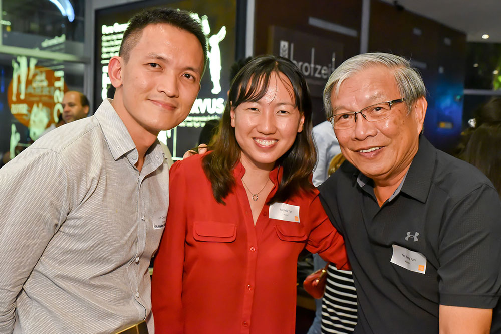 From left: Chee Siang, Michelle Tan (Class of 2010) and Yeo Keng Joon (Class of 1985) at the same alumni dinner event