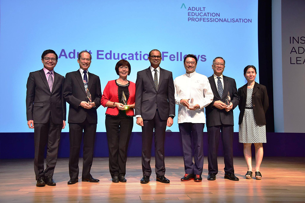 Professor Chia (second from left) with the Adult Education Fellows and Dr Janil Puthucheary (centre)