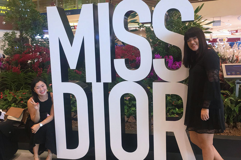 Crystal (right) at a Miss Dior EDP Mega Event at Changi Airport while interning for Dior