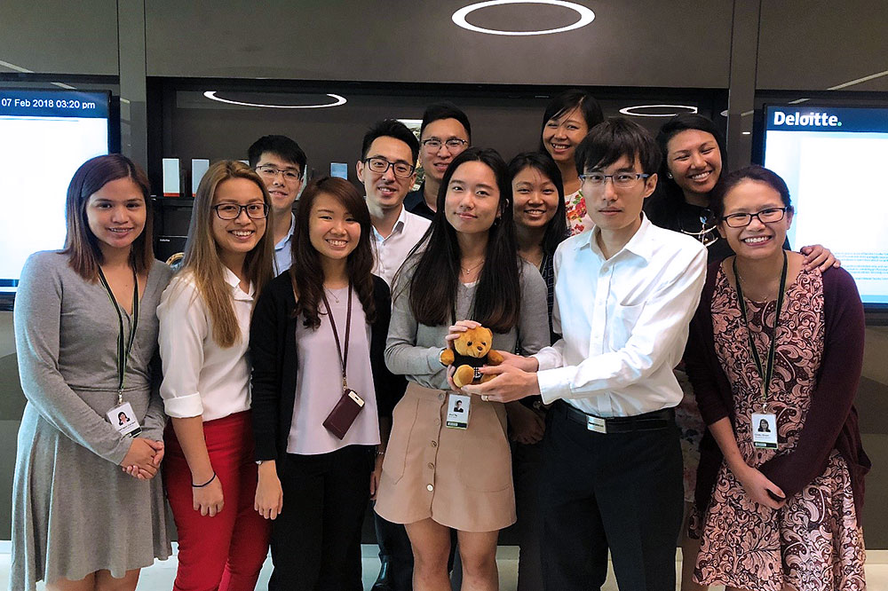 Lixia (centre with bear) with her team from Audit and Assurance
