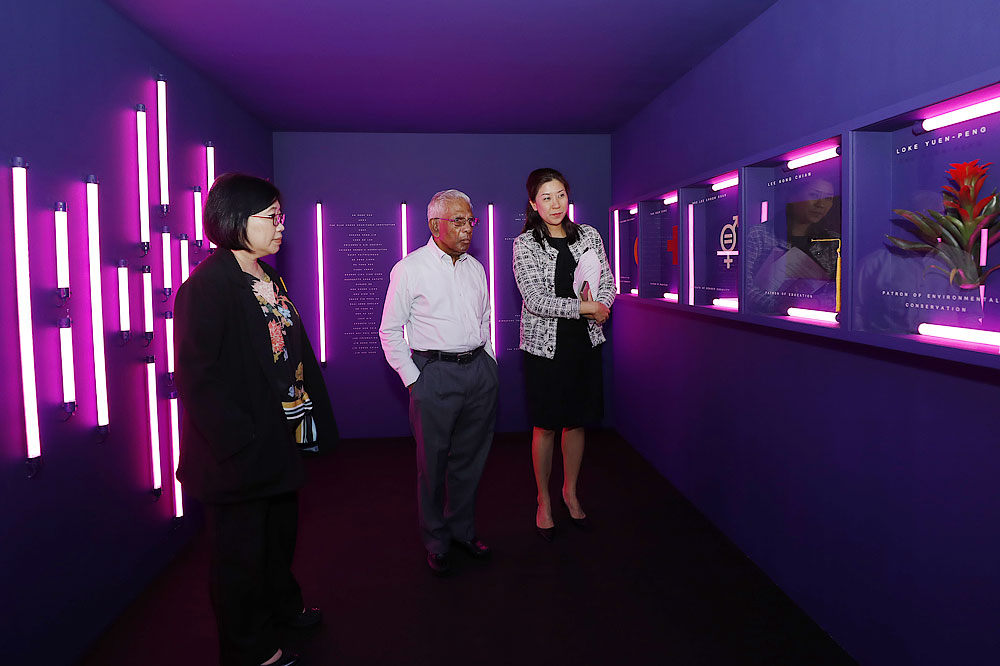 Ms Yvonne Tay (right), Director of Temasek Shophouse, sharing more about the philanthropists profiled in the exhibition, For Love Shines, An Ode to 200 years of Philanthropy in Singapore, with Mr S Dhanabalan (centre), Temasek Trust Chairman, and Ms Woon Saet Nyoon, Chief Executive of Temasek Foundation Cares (left).