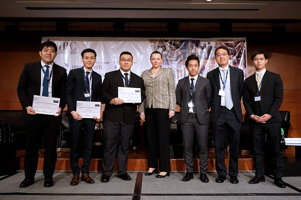 The champions! From left: Chris, Chong Wei and Kah Keong with executives from AIBC, CAIA Association and HSBC.