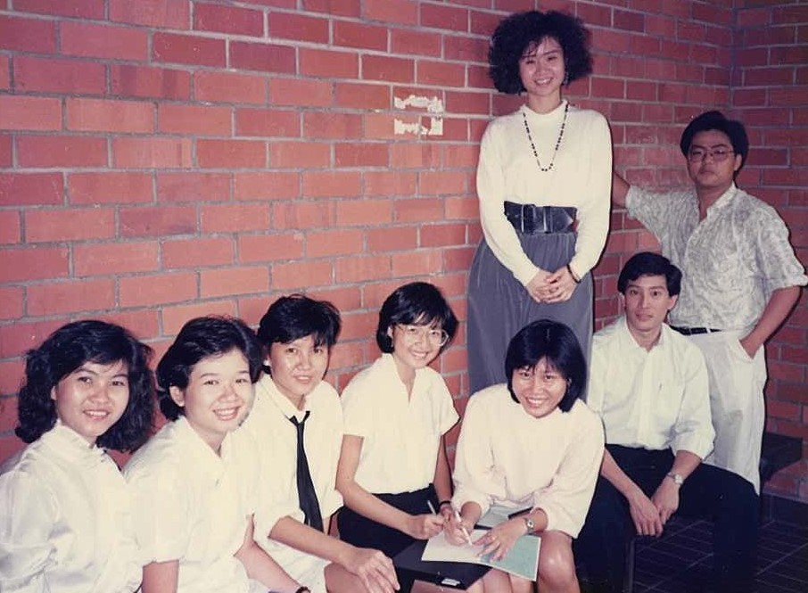 With Honours Year classmates in 1988 outside the Honours Room in BIZ 2 (from left to right): Pang Kiah Jee, Tong Pik Yi, Sum Yim Ling, Christine Goh Lee Eng, me, Leong Sow Fung (standing), Philip Lim Wei Tong and Mark Chan Boon Kiong.