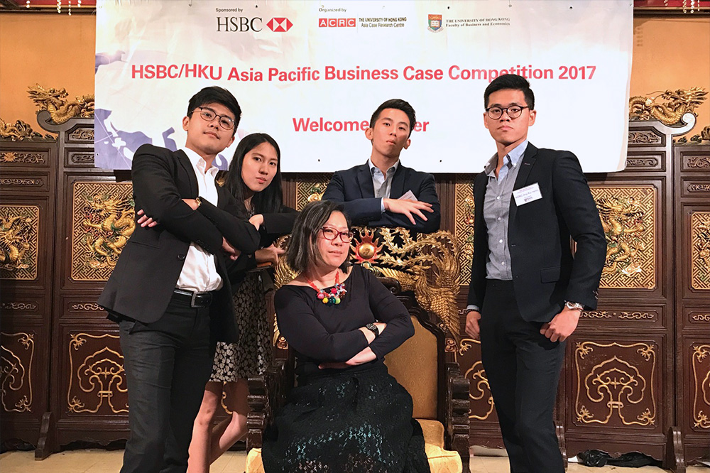 The NUS Team at an international case competition held in Hong Kong. From left standing: Bentley Wee, Janel Ong, Lester Ng and Henry Ong; with Professor Ang Swee Hoon (sitting)