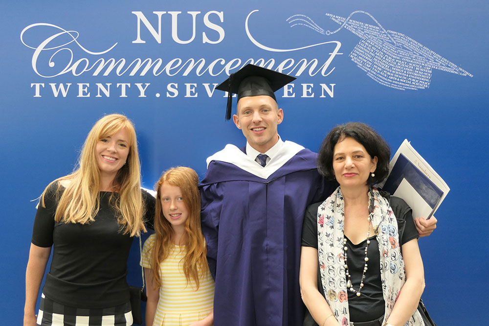 Sean (second from right) with his family during his Commencement