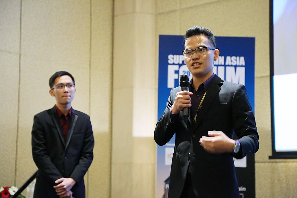 Nelson (right) presenting in a competition organised by Supply Chain Asia.