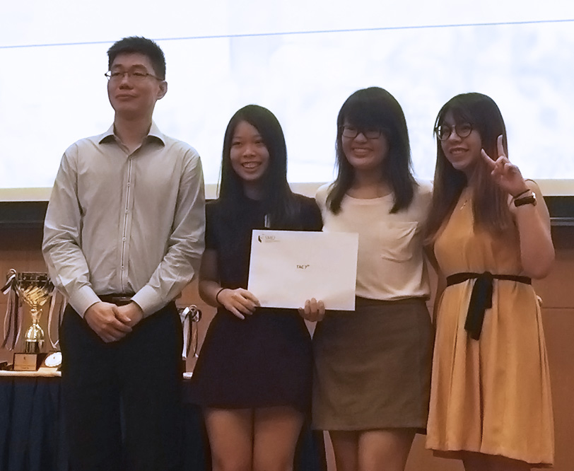 From left: Competition judge Tan Siau Yan of IRAS with Team Taxwits (represented by Tan Shi Ying, Low Jie Ying and Emily Chng Hsin Ying)