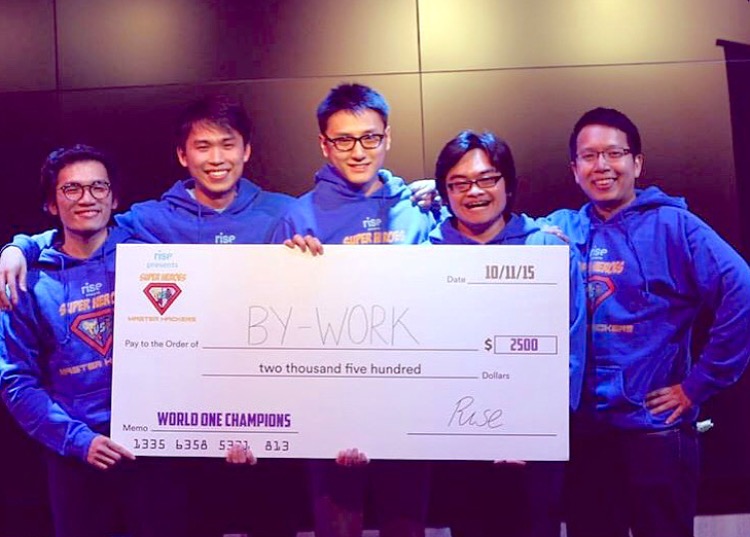 Albert (left) winning top honours with his team at a hackathon, while studying in New York University as part of the NUS NOC programme