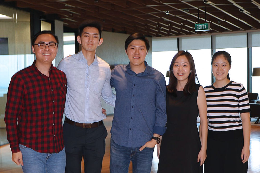 Clarence Chan (centre), Vice President at MUFG Bank, Bachelor of Business Administration – Finance (2010), with the NUS Business School Alumni (NUSBSA) team