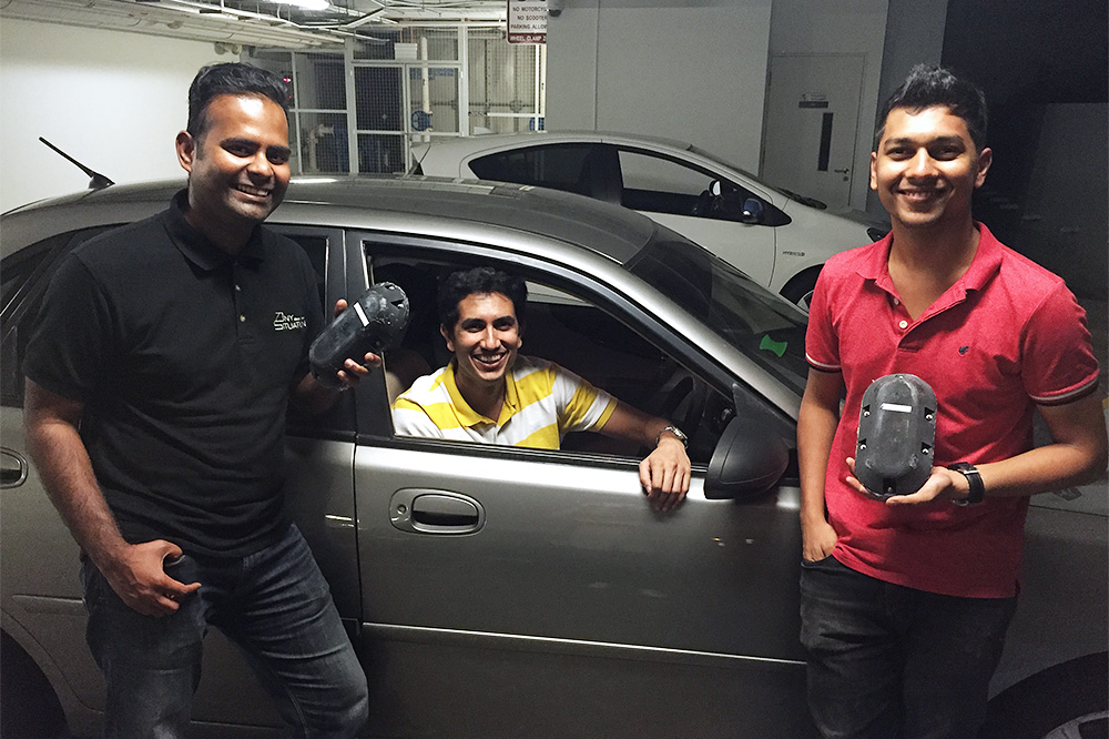Neil Mehta (middle) with his engineers and car sensors