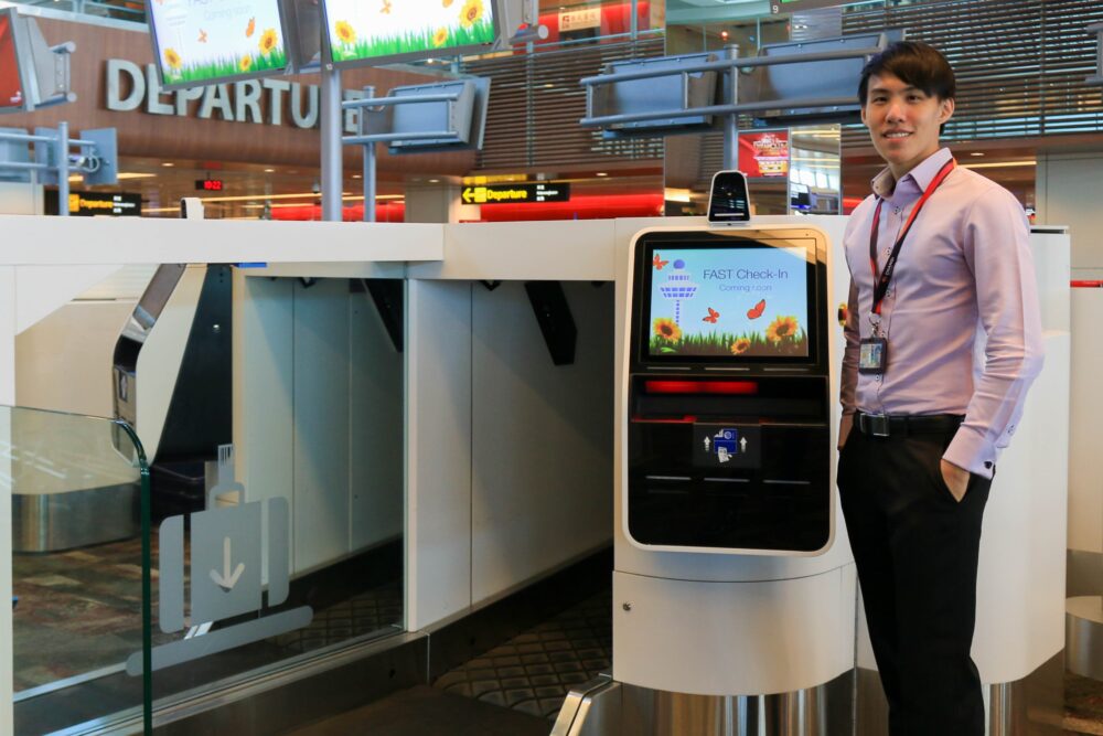 Lucas Lee standing by CAG’s automated bag-drop during the trial phase