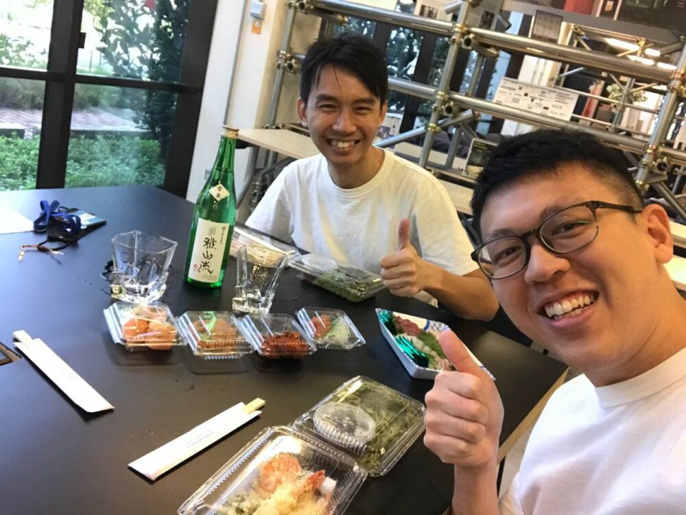 Jason (right) having lunch with his boss and AutoWealth bursary benefactor, Mr Ow Tai Zhi