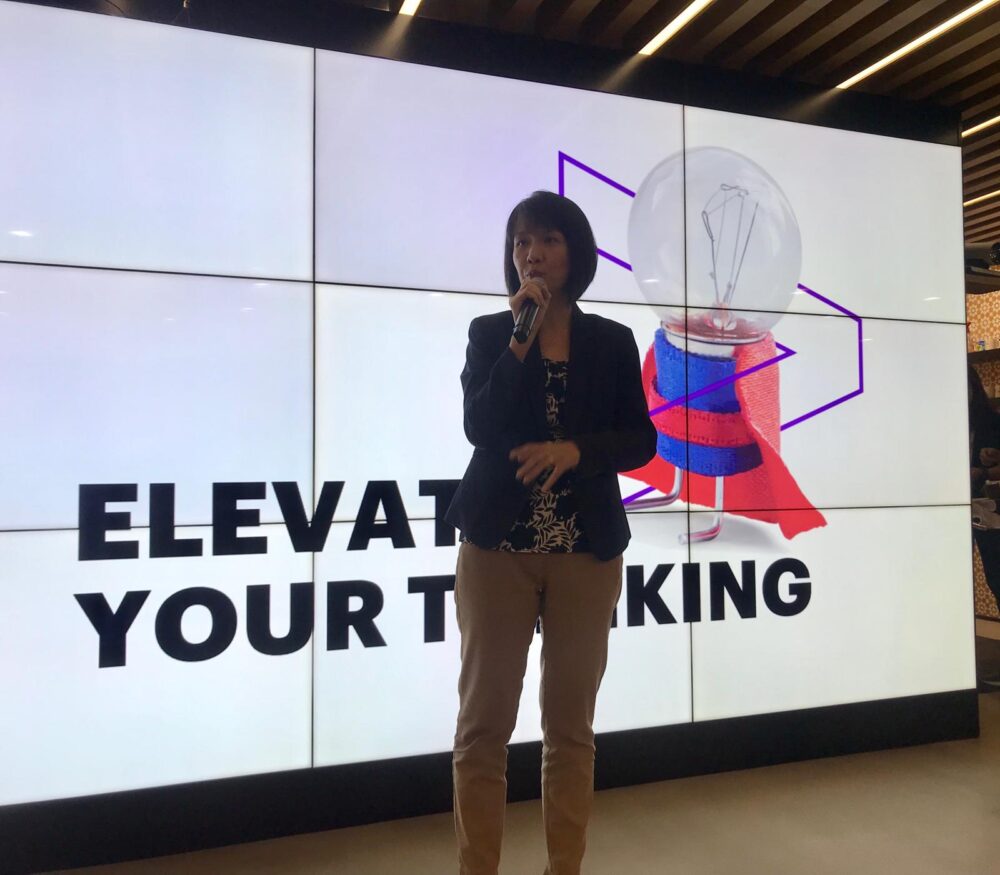 Sher Li speaking at an Accenture event