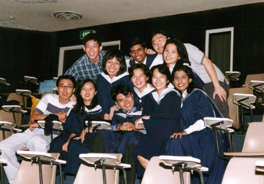 Sher Li (back row, second from left) with the same orientation group mates on graduation day