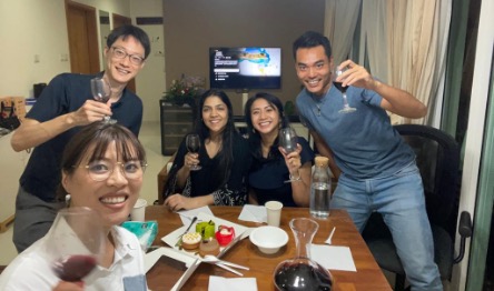 Stacy (1st from left) hosted dinner for students at home. 