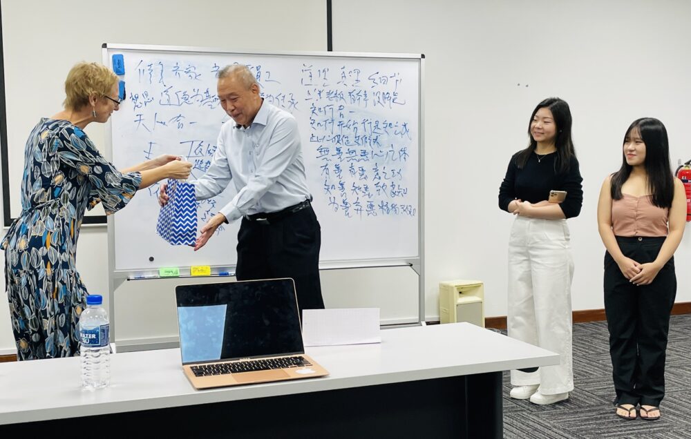 Associate Professor Marleen appreciating Mr Lim with a personal gift