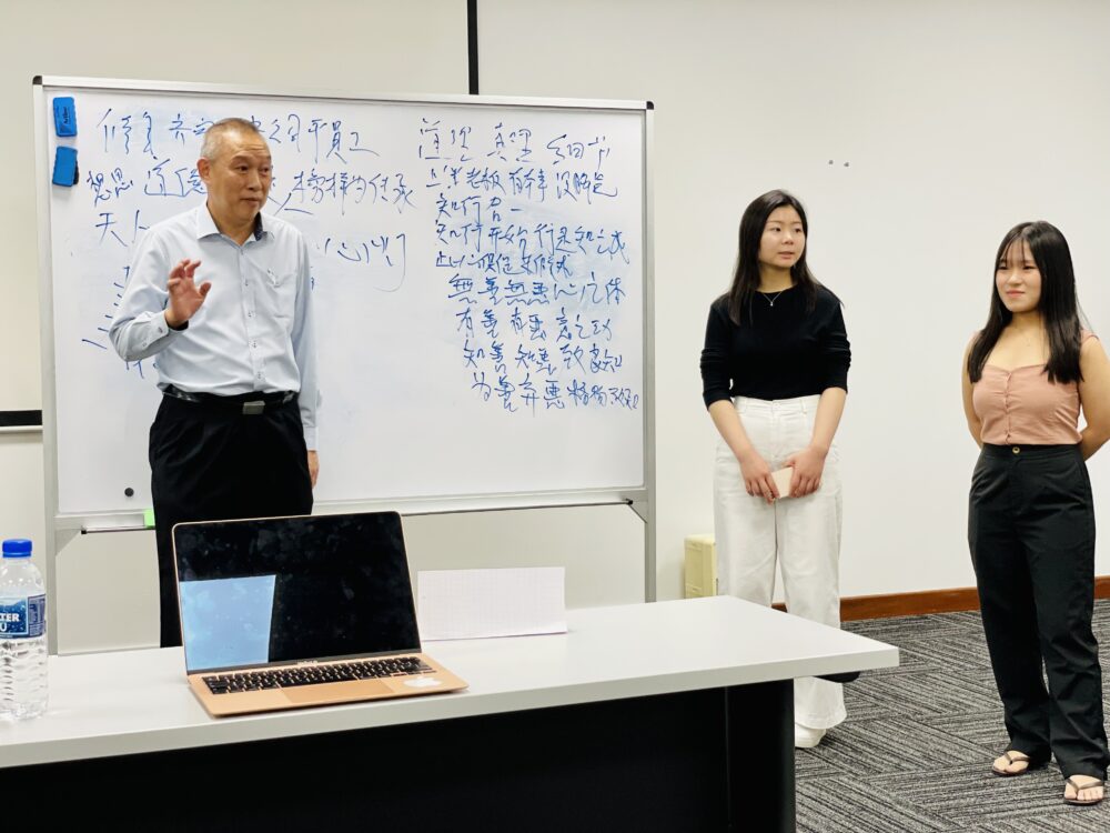 Annotating and teaching in Mandarin, with the help of student translator Yu Jing