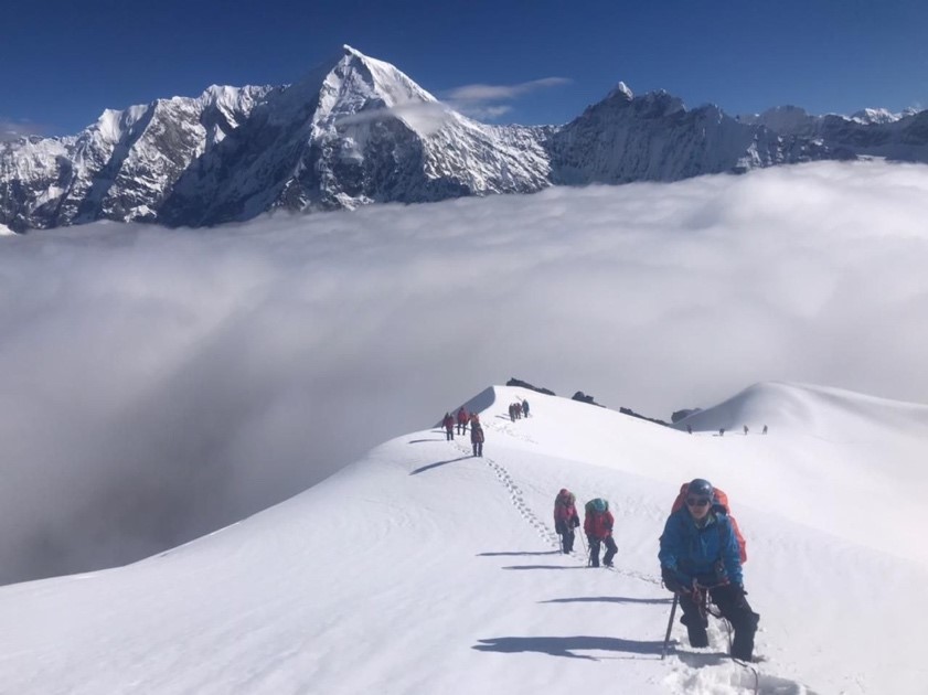 Paul and his team traversing the icy slopes of the Nepalese mountain range