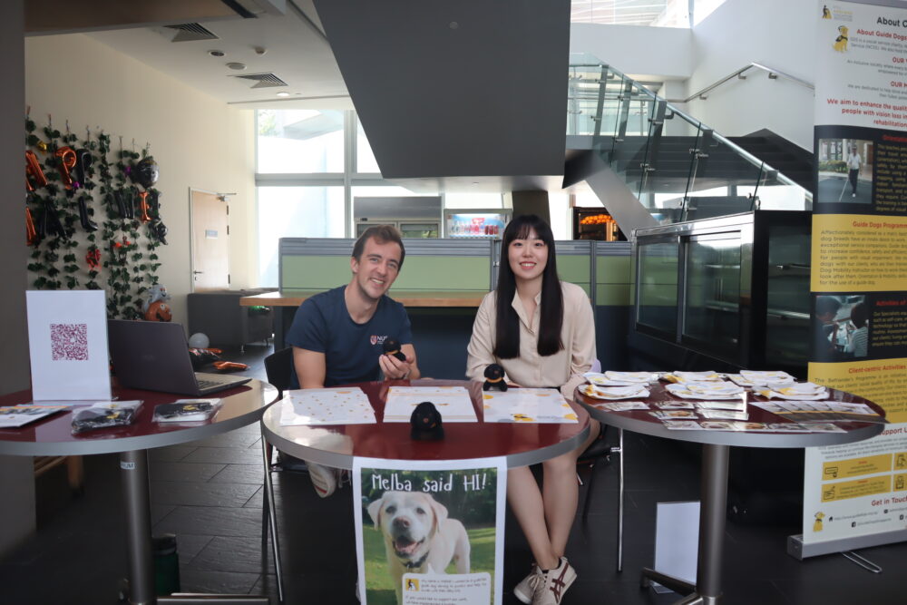 MSc Finance students Kilian Wignanek (left) and Tian Zuyu are part of the team behind the fundraiser for Guide Dogs Singapore.