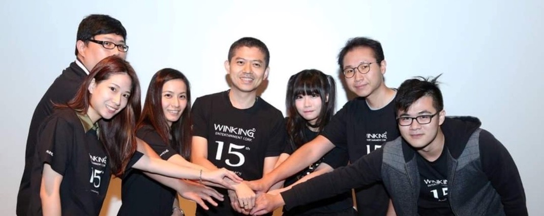 Johnny Jan (centre), founder and CEO of WINKING Corporation, and his teammates.